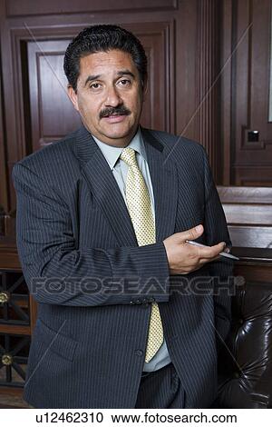 Man standing in court, portrait View Large Photo Image Stock Image - Man standing in court, portrait. Fotosearch