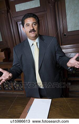 Stock Image - Man standing in court, portrait. Fotosearch