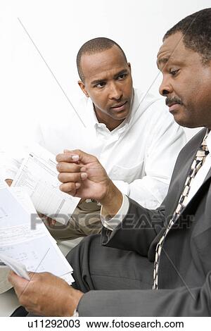 Stock Image - Man Talking with Accountant. Fotosearch