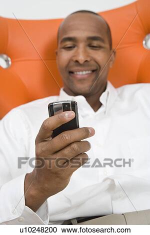 Man Using a Cell Phone View Large Photo Image Stock Image - Man Using a Cell Phone. Fotosearch