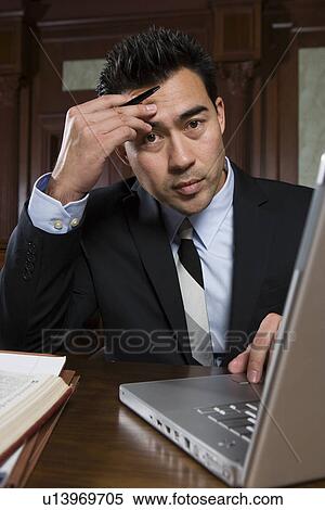 Man using laptop in court, portrait View Large Photo Image Stock Photography - Man using laptop in court, portrait. Fotosearch
