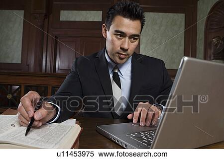 Man using laptop in court View Large Photo Image Stock Photography - Man using laptop in court. Fotosearch
