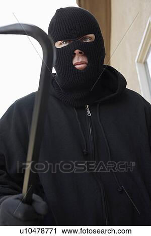 Man wearing balaclava and holding crowbar View Large Photo Image Stock Image - Man wearing balaclava and holding crowbar. Fotosearch