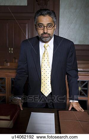 Man wearing suit in court, portrait View Large Photo Image Stock Image - Man wearing suit in court, portrait. Fotosearch