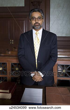 Man wearing suit in court, portrait View Large Photo Image Stock Photo - Man wearing suit in court, portrait. Fotosearch
