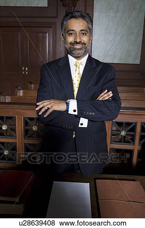 Stock Photo - Man wearing suit in court, portrait. Fotosearch