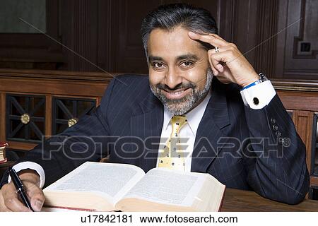 Stock Image - Man writing in court, portrait. Fotosearch