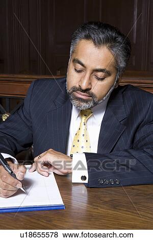 Man writing in court View Large Photo Image Stock Photo - Man writing in court. Fotosearch