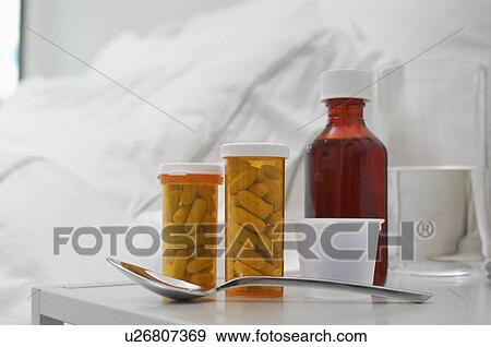 Medication on bedside table, close-up View Large Photo Image Stock Photo - Medication on bedside table, close-up. Fotosearch