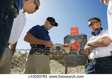 Men watching instructor at combat training in desert View Large Photo Image Stock Image - Men watching instructor at combat training in desert. Fotosearch