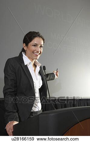 Mid adult woman lecturing View Large Photo Image Stock Photo - Mid adult woman lecturing. Fotosearch