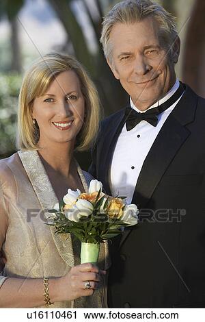 Middle-aged couple in formal wear, portrait View Large Photo Image Stock Image - Middle-aged couple in formal wear, portrait. Fotosearch