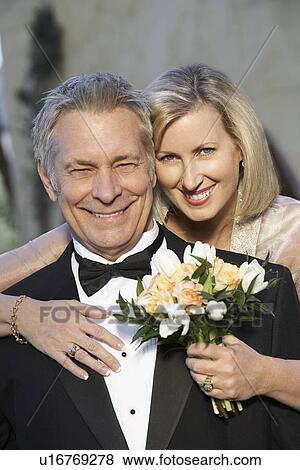 Stock Photo - Middle-aged couple in formal wear, portrait. Fotosearch