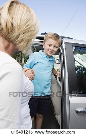 Stock Photography - Mother Driving Son to School. Fotosearch