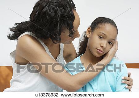 Mother embracing daughter (7-9) in hospital View Large Photo Image Stock Image - Mother embracing daughter (7-9) in hospital. Fotosearch