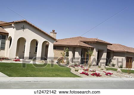 Stock Image - New House With Arched Entry. Fotosearch