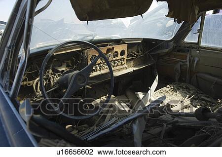 Stock Image - Old broken car interior. Fotosearch