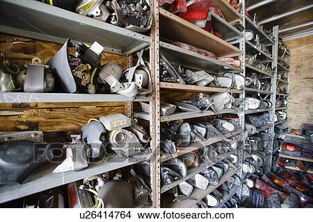 Picture - Old car parts in junkyard. Fotosearch