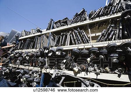 Stock Photograph - Old car parts in junkyard. Fotosearch