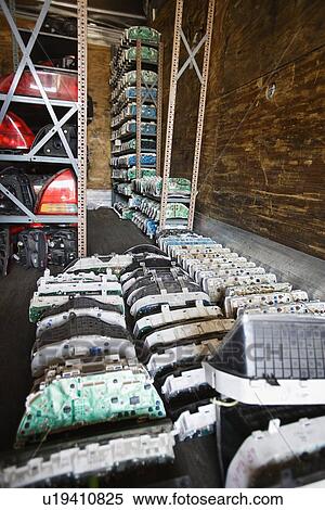 Stock Photography - Old car parts in junkyard. Fotosearch
