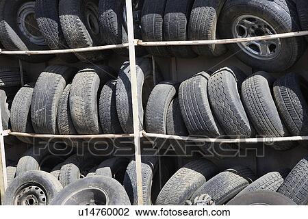 Stock Image - Old tires in rack. Fotosearch