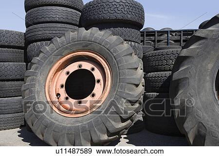 Stock Photo - Old tires in recycling centre. Fotosearch