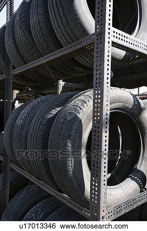 Stock Photograph - Old tires in recycling centre. Fotosearch
