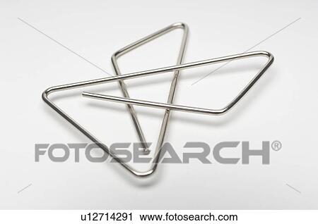 Stock Image - Paper clip on white background. Fotosearch
