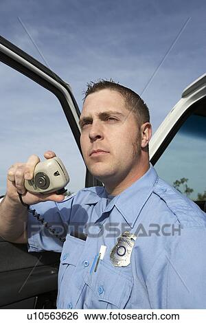 Stock Photograph - Paramedic using CB radio. Fotosearch