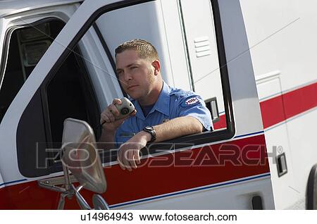Paramiedic using CB radio, leaning on ambulance View Large Photo Image Stock Image - Paramiedic using CB radio, leaning on ambulance. Fotosearch