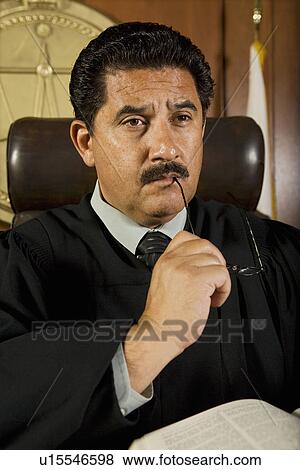 Stock Photo - Pensive judge in court. Fotosearch