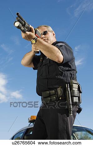 Police Officer Aiming Shotgun View Large Photo Image Picture - Police Officer Aiming Shotgun. Fotosearch