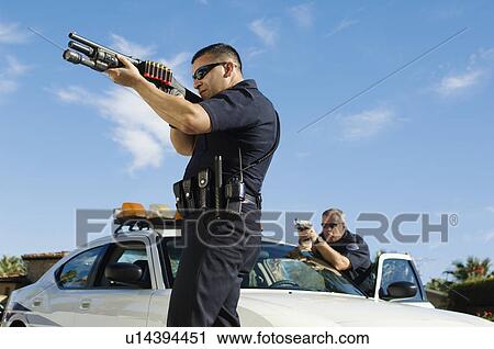 Police Officer Aiming Shotgun View Large Photo Image Stock Image - Police Officer Aiming Shotgun. Fotosearch
