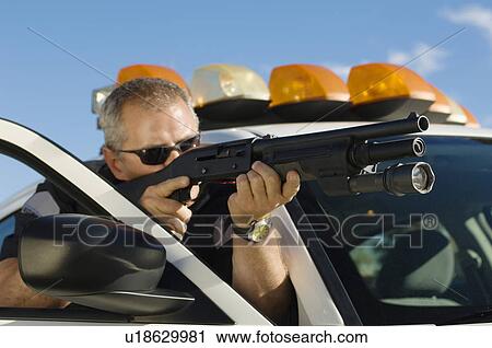 Police Officer Aiming Shotgun View Large Photo Image Stock Image - Police Officer Aiming Shotgun. Fotosearch