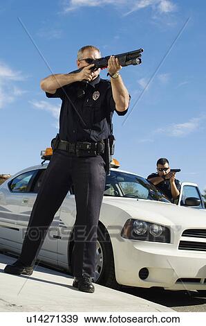 Police Officer Aiming Shotgun View Large Photo Image Stock Photo - Police Officer Aiming Shotgun. Fotosearch