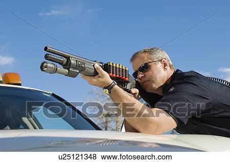 Police Officer Aiming Shotgun View Large Photo Image Stock Photo - Police Officer Aiming Shotgun. Fotosearch