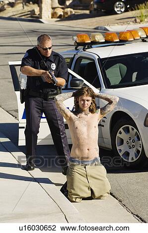 Police Officer Arresting Young Man View Large Photo Image Stock Image - Police Officer Arresting Young Man. Fotosearch