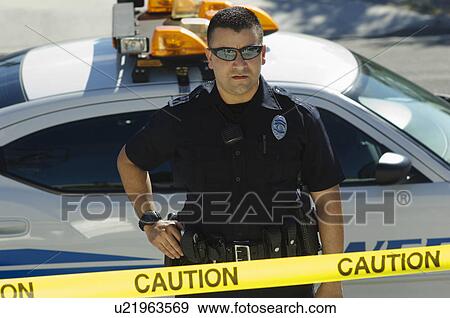 Police Officer Standing Behind Police Tape View Large Photo Image Stock Photo - Police Officer Standing Behind Police Tape. Fotosearch