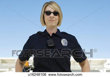 Stock Photo - Police Officer Wearing Sunglasses. Fotosearch