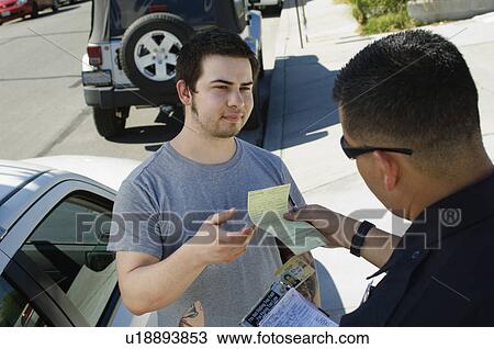 Stock Image - Police Officer Writing Ticket. Fotosearch