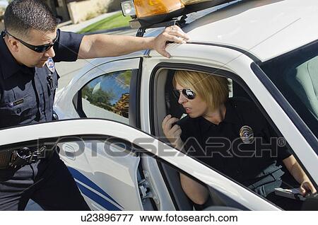 Police Officers Talking in Police Car View Large Photo Image Stock Photo - Police Officers Talking in Police Car. Fotosearch