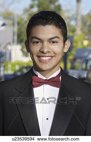 Picture - Portrait of boy (13-15) in tuxedo at Quinceanera. Fotosearch