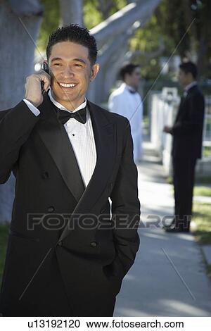 Portrait of boy (13-15) in tuxedo at Quinceanera, using mobile phone View Large Photo Image Stock Image - Portrait of boy (13-15) in tuxedo at Quinceanera, using mobile phone. Fotosearch