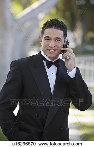 Portrait of boy (13-15) in tuxedo at Quinceanera, using mobile phone View Large Photo Image Stock Image - Portrait of boy (13-15) in tuxedo at Quinceanera, using mobile phone. Fotosearch