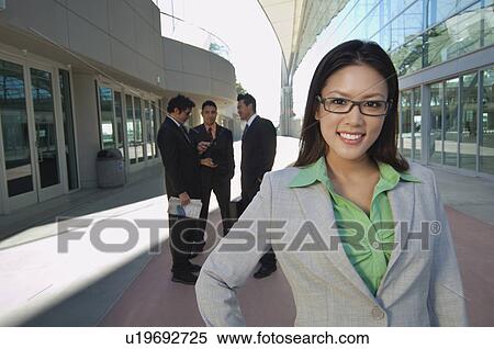 Portrait of businesswoman in front of office building View Large Photo Image Stock Photography - Portrait of businesswoman in front of office building. Fotosearch