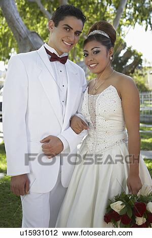 Stock Image - Portrait of couple (13-15) at Quinceanera. Fotosearch