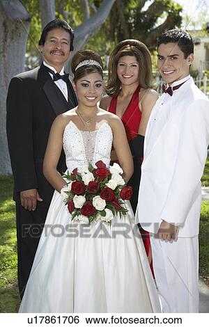 Portrait of couple (13-15) with parents at Quinceanera View Large Photo Image Stock Photograph - Portrait of couple (13-15) with parents at Quinceanera. Fotosearch