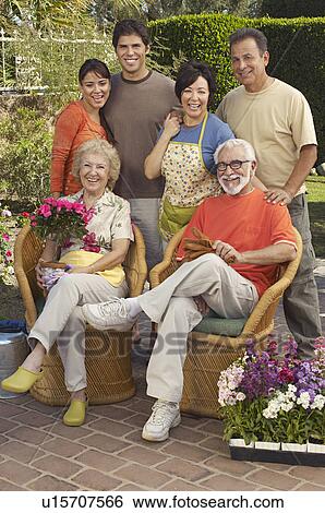 Portrait of family in garden View Large Photo Image Stock Photograph - Portrait of family in garden. Fotosearch