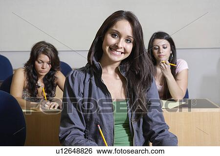 Portrait of female student in class View Large Photo Image Stock Photograph - Portrait of female student in class. Fotosearch