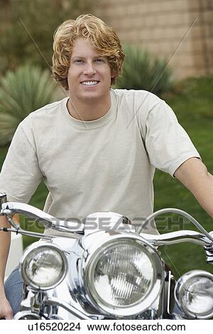 Picture - Portrait of man on motorbike. Fotosearch